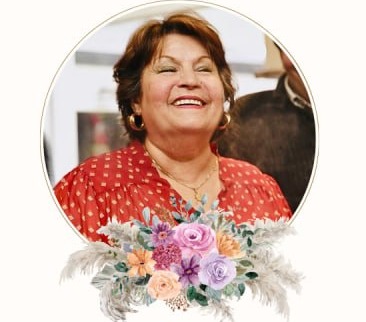 Fery Khoshmashrab smiling above pastel flowers